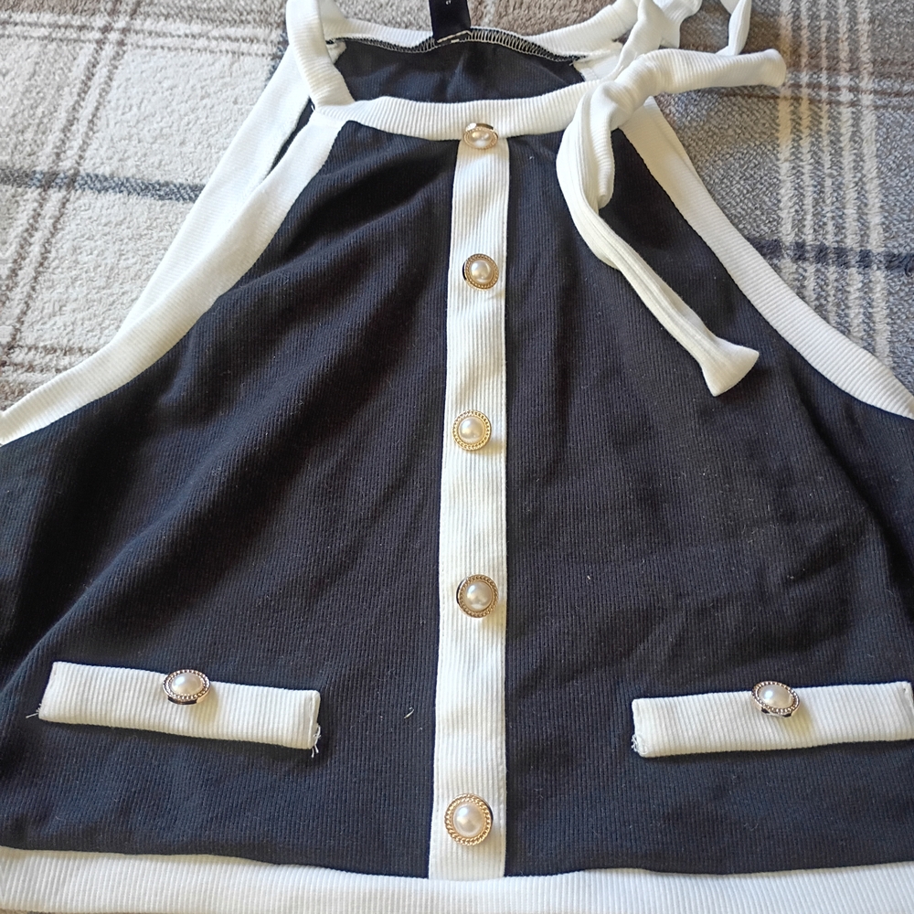 Black and White Sleeveless Top with Button Accents